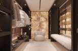 This luxurious ski room boasts custom cabinetry, ample storage for skis and snowboards, and a built-in wine cellar.