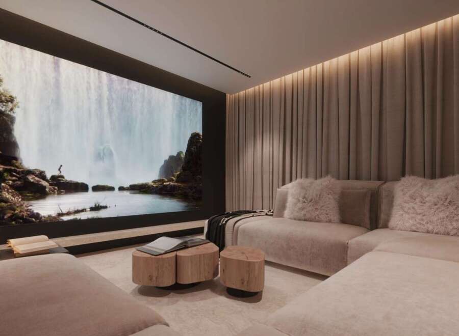 Luxurious home theater with a large projection screen showcasing a breathtaking waterfall scene.