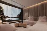 Luxurious home theater with a large projection screen showcasing a breathtaking waterfall scene.