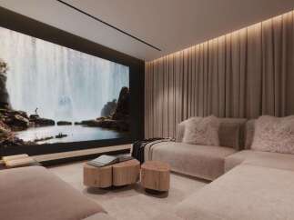 Luxurious home theater with a large projection screen showcasing a breathtaking waterfall scene.