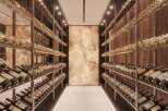 This luxurious property boasts a stunning, temperature-controlled wine cellar, showcasing an extensive collection of fine wines.