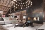 Luxury chalet with stunning wooden beams and a large metal fireplace.