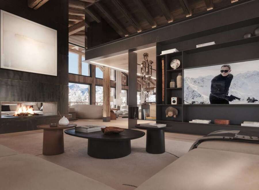 This luxurious chalet boasts a stunning open-plan living area with a large fireplace and floor-to-ceiling windows offering breathtaking mountain views.