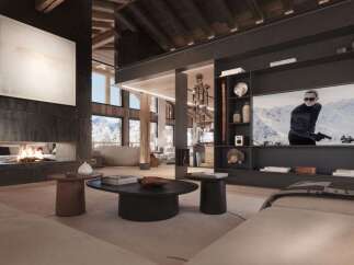 This luxurious chalet boasts a stunning open-plan living area with a large fireplace and floor-to-ceiling windows offering breathtaking mountain views.