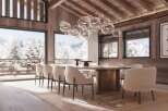 Luxury chalet with stunning mountain views and a spacious dining area.