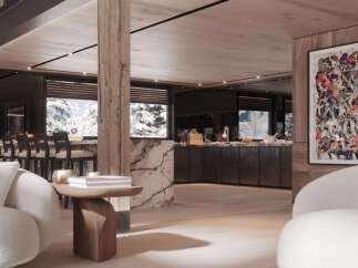 This luxurious chalet boasts a stunning open-plan living area with floor-to-ceiling windows offering breathtaking mountain views.
