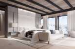 Luxurious mountain retreat boasting a stunning master bedroom with breathtaking views.
