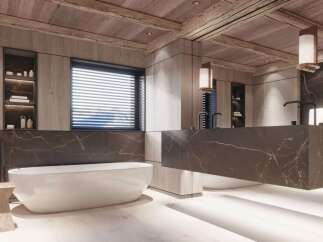 Luxurious bathroom with a freestanding bathtub and floating marble vanity.
