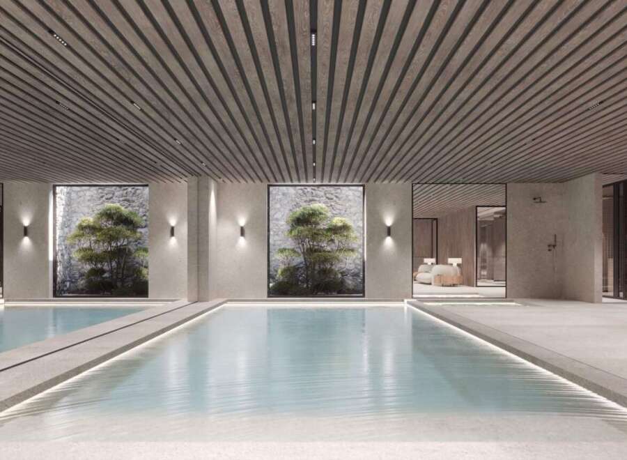 Indulge in the tranquility of this stunning indoor pool, featuring a sleek design and natural light.
