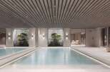 Indulge in the tranquility of this stunning indoor pool, featuring a sleek design and natural light.