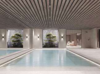 Indulge in the tranquility of this stunning indoor pool, featuring a sleek design and natural light.