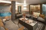 Luxurious chalet featuring a stunning indoor pool and spa area.