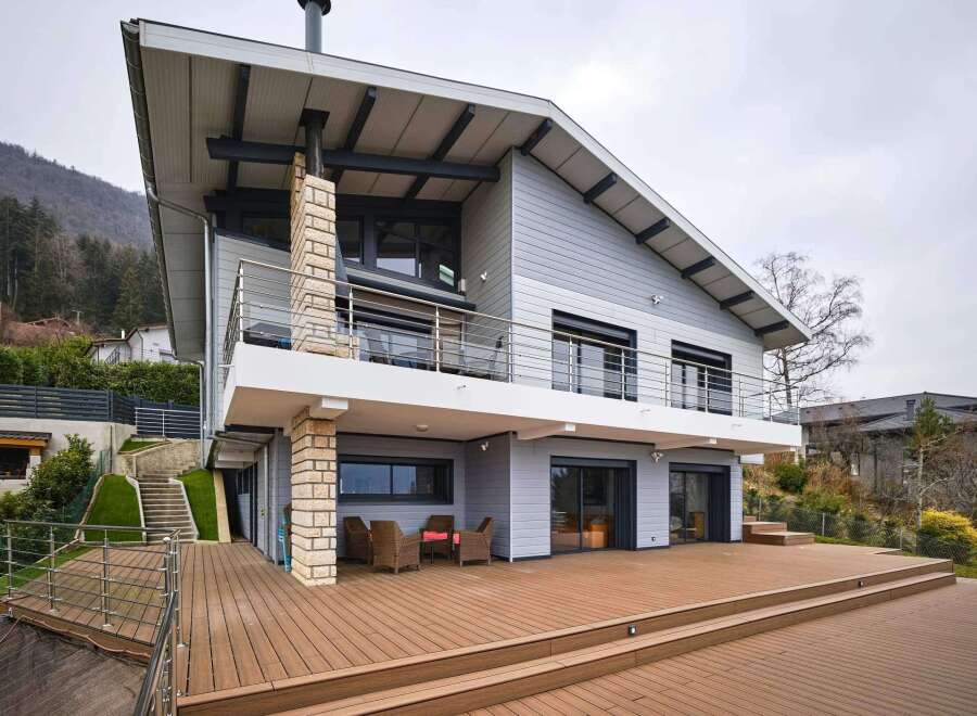 Stunning modern home with expansive deck and mountain views.