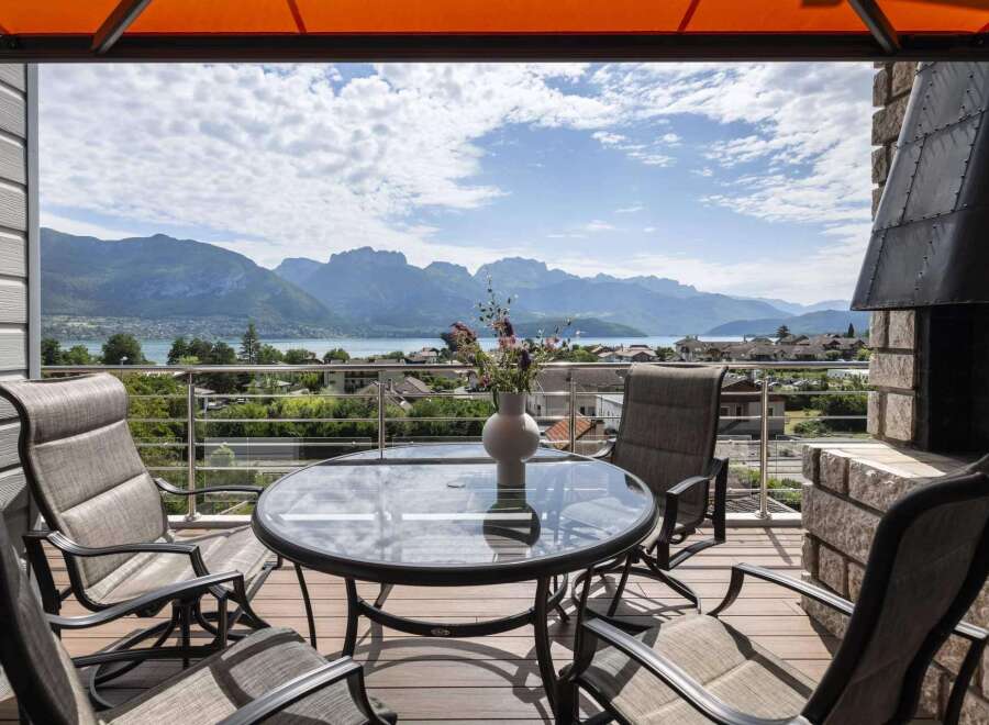 Enjoy breathtaking mountain and lake views from this stunning balcony.