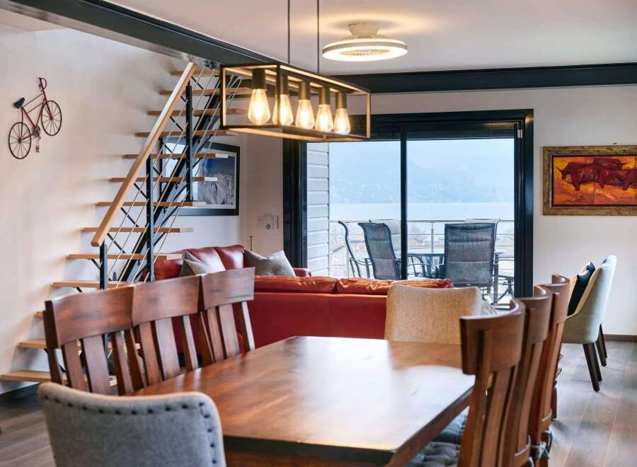Stunning lake views from this modern apartment's dining area.
