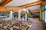 This stunning loft boasts exposed wooden beams, creating a warm and inviting atmosphere.