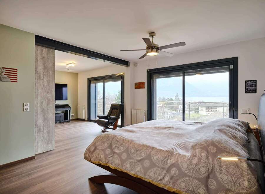 Luxurious bedroom with stunning lake views.