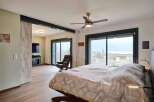 Luxurious bedroom with stunning lake views.