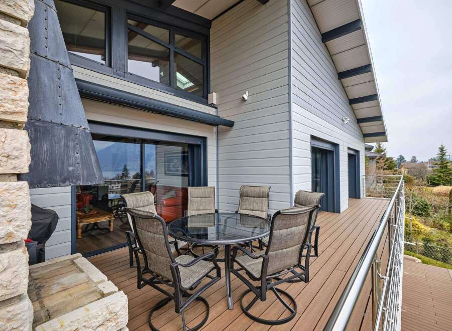 This stunning property boasts a spacious deck with breathtaking views, perfect for outdoor entertaining.
