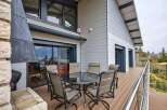 This stunning property boasts a spacious deck with breathtaking views, perfect for outdoor entertaining.