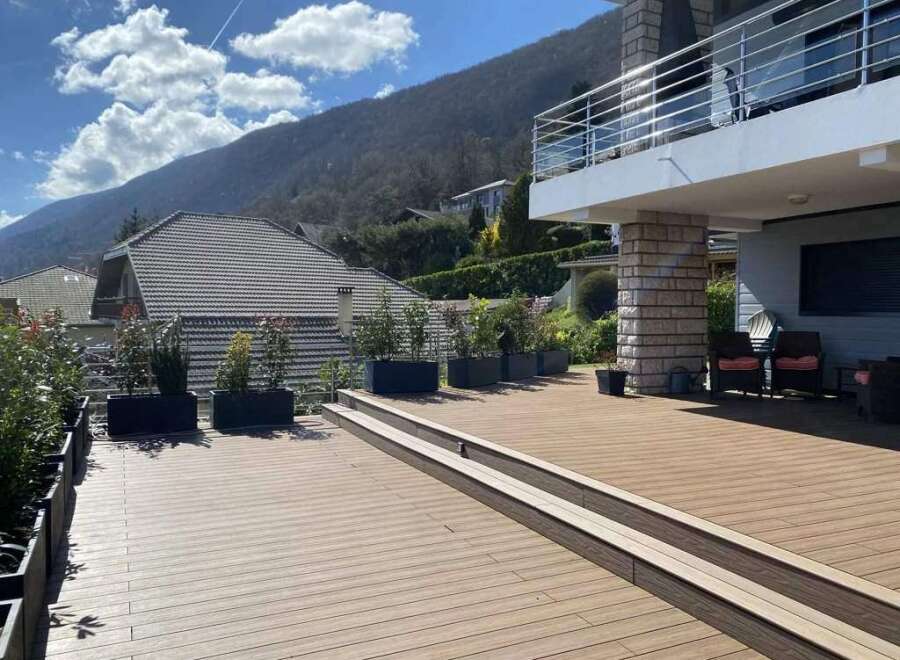 Luxury mountain villa with stunning views and spacious deck.