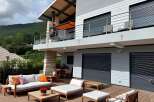 Luxury mountain home with stunning views and spacious outdoor deck.