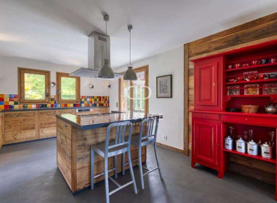 This stunning kitchen boasts a rustic charm with its wooden cabinetry and island.