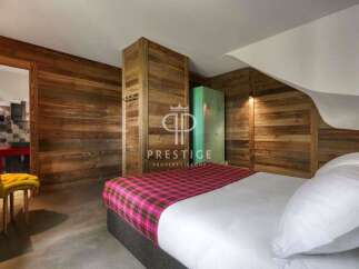 Experience rustic charm in this stunning property, featuring beautiful wooden walls and a cozy atmosphere.