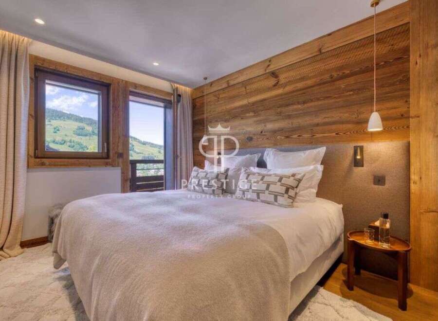 Experience luxury in this stunning bedroom with breathtaking mountain views.