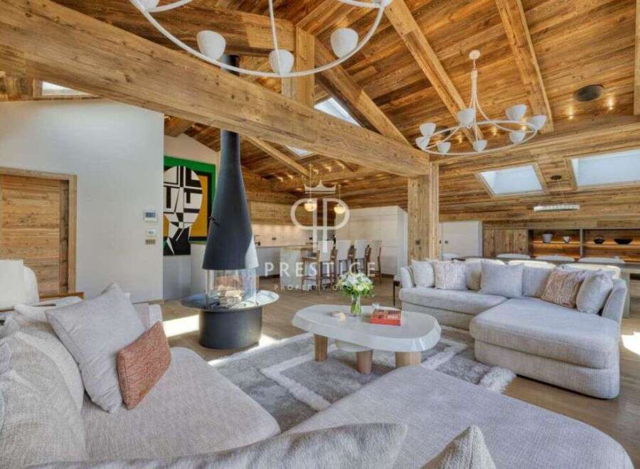 Experience luxury living in this stunning property, featuring a cozy fireplace and a spacious living area.