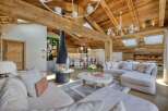 Experience luxury living in this stunning property, featuring a cozy fireplace and a spacious living area.