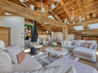 Experience luxury living in this stunning property, featuring a cozy fireplace and a spacious living area.