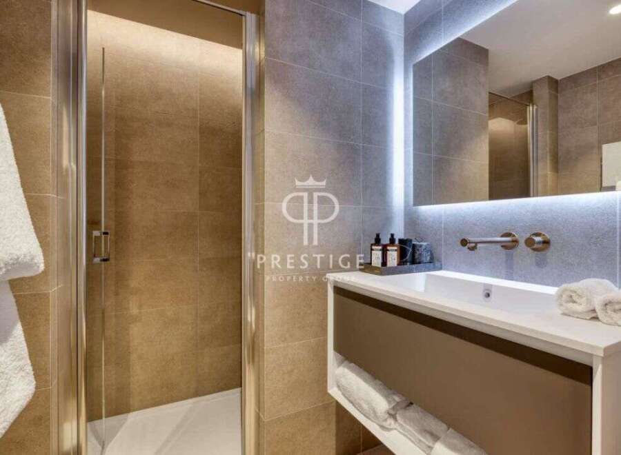 Discover luxury living in this stunning property! Featuring a modern bathroom with sleek design and high-end finishes.
