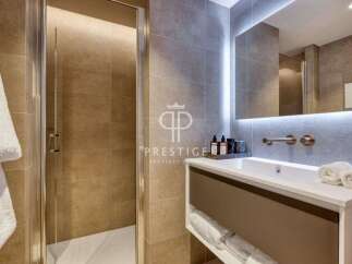 Discover luxury living in this stunning property! Featuring a modern bathroom with sleek design and high-end finishes.