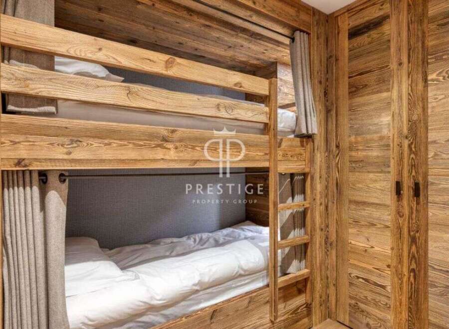 Discover the charm of this cozy bunk bed room, perfect for a family getaway.