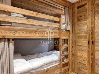 Discover the charm of this cozy bunk bed room, perfect for a family getaway.