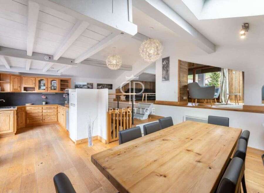 Discover the charm of this stunning property, featuring a spacious kitchen and a cozy dining area perfect for gatherings.