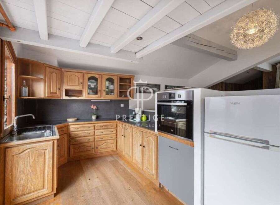 Discover the charm of this kitchen, featuring warm wooden cabinetry and a functional layout.