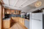 Discover the charm of this kitchen, featuring warm wooden cabinetry and a functional layout.