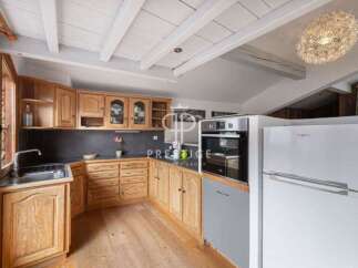 Discover the charm of this kitchen, featuring warm wooden cabinetry and a functional layout.