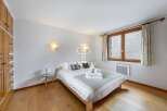 Discover a cozy bedroom with a comfortable bed, perfect for relaxation.
