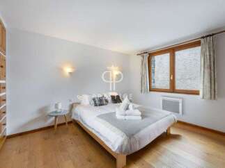 Discover a cozy bedroom with a comfortable bed, perfect for relaxation.