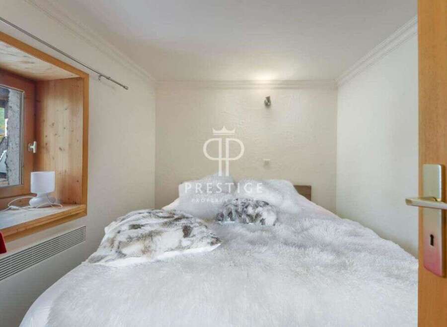 Cozy bedroom with a plush, inviting bed.