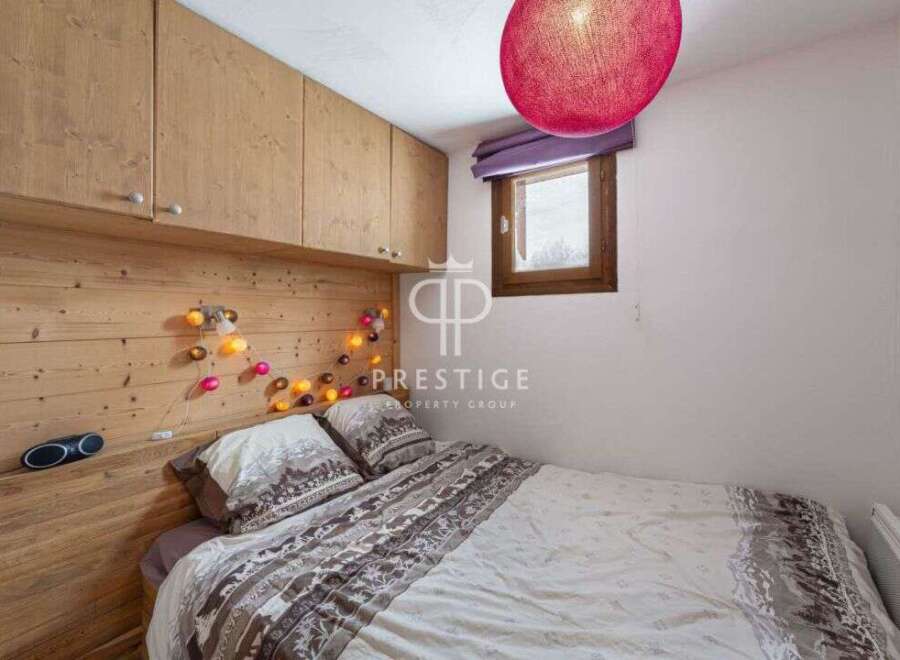 Cozy bedroom with wooden accents and a warm ambiance.