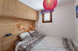 Cozy bedroom with wooden accents and a warm ambiance.