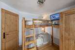 Cozy bedroom featuring a bunk bed, perfect for accommodating guests or family.
