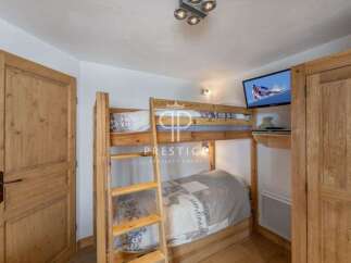 Cozy bedroom featuring a bunk bed, perfect for accommodating guests or family.