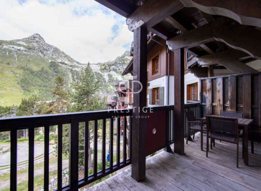 Enjoy breathtaking mountain views from this charming balcony.