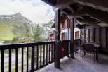 Enjoy breathtaking mountain views from this charming balcony.