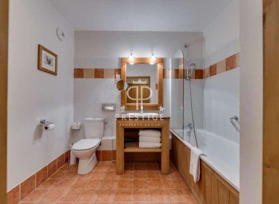 Discover a charming bathroom with a rustic touch.